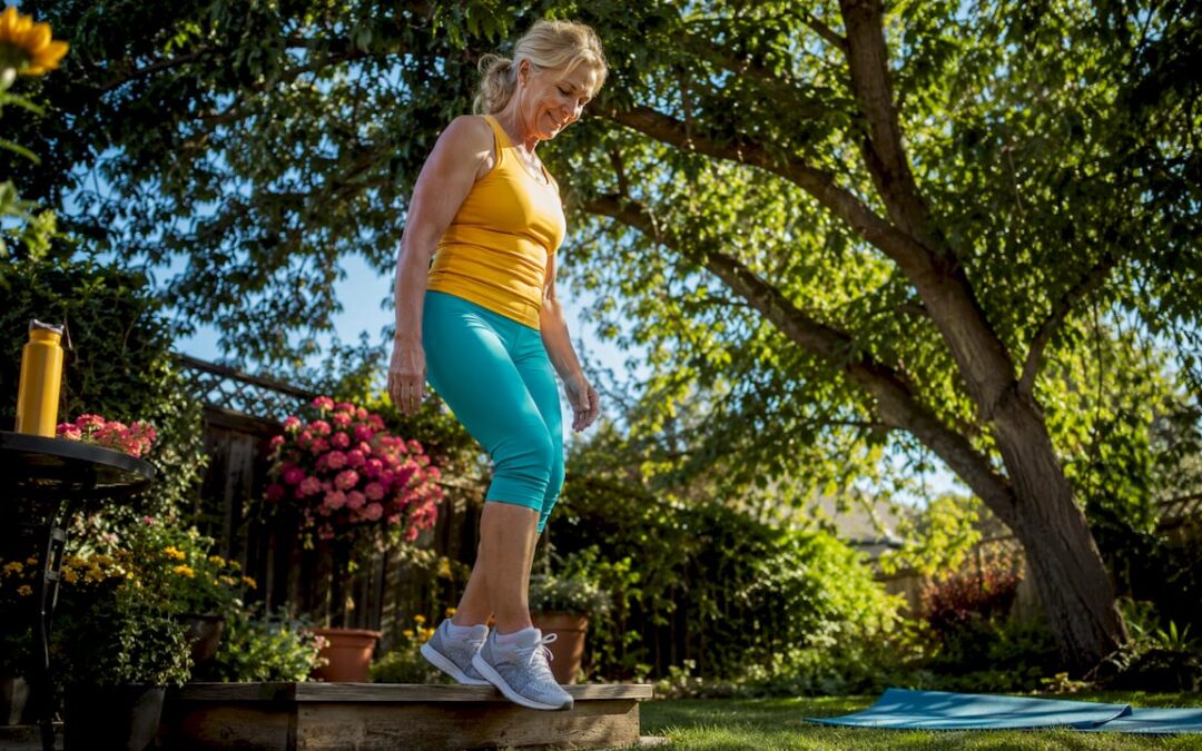 Woman doing heel drops exercise indoors
