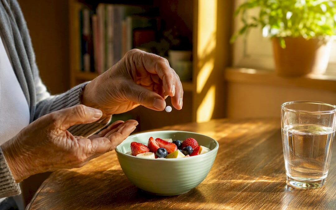 Hands taking bisphosphonate tablet with water
