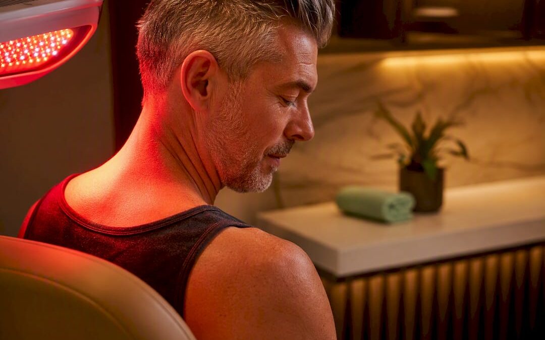 Adult receiving red light therapy treatment